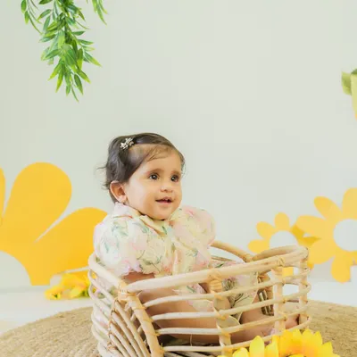Blooming with joy just like these sunflowers. Our little sunshine lights up every moment with her giggles and charm.