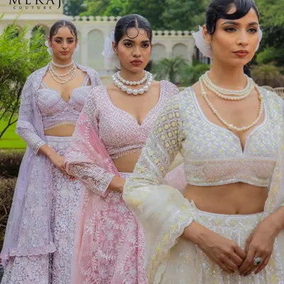 Colors that capture your heart. This image showcases my 'Ruvaah' bridal lehengas in pastel lilac and soft pink, adorned with intricate 3D florals and fine detailing.