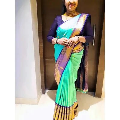 A client looking stunning in a sea-green and purple silk saree I draped for her. My focus is on creating a flawless silhouette with perfect pleats.