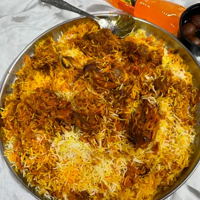 A huge thaal of my Chicken Drumstick Biryani, ready to be served. The rice is fragrant and the drumsticks are cooked perfectly, making it a lazeez meal for any party.
