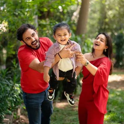 Pure, unrestrained joy during an outdoor family photoshoot. Lifting their son in the air brings out the biggest smiles and most genuine laughter, which is exactly what I aim to capture.