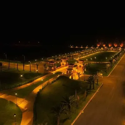 An evening aerial view of the Janpath estate, highlighting the network of illuminated pathways and roads. The lighting design creates a safe and inviting environment for residents while accentuating the community's layout.
