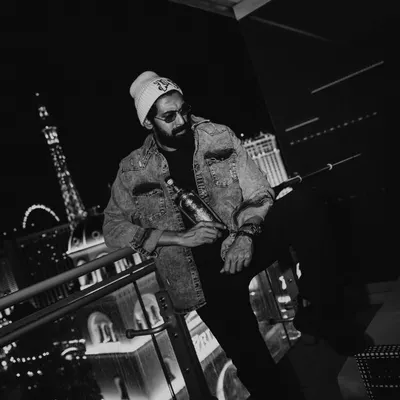 The same Loca Loka Tequila campaign with Rana Daggubati, this time in black and white. The lack of color emphasizes the textures of the denim jacket and beanie, creating a gritty, timeless feel.