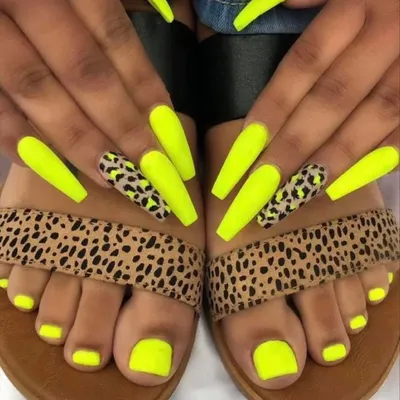 I love creating matching manicure and pedicure sets. This client went for a bold neon yellow with leopard print accent nails on her hands, perfectly coordinating with her solid neon toes.