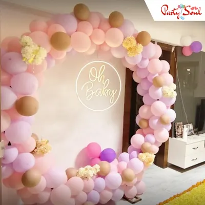 An elegant "Oh Baby" themed setup perfect for a sophisticated baby shower. I used a pastel palette of pink, lilac, and beige balloons to create this soft circular arch, adding a custom neon sign as a lovely focal point.