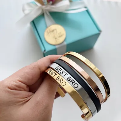 A modern take on the traditional Rakhi. These personalized stainless steel bracelets are water-resistant and can be engraved with a name or message like "Best Bro".