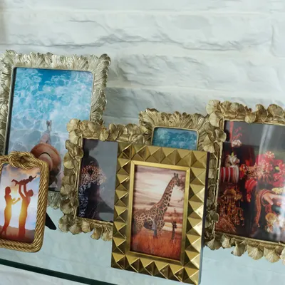 An eclectic collection of our decorative photo frames, showcasing the variety of styles we offer. From antique gold finishes to modern studded designs, there is a frame to match any decor and personality.