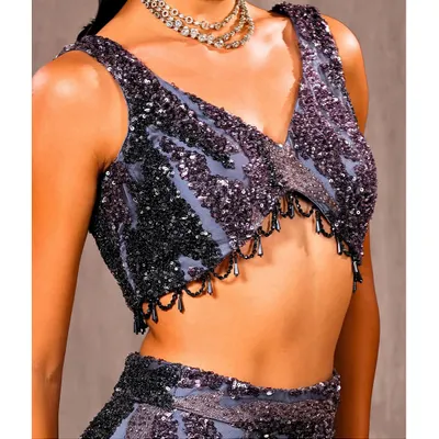 A close-up of the hand-beaded blouse. You can see the detailed sequin patterns and delicate drop beads that my team meticulously applies to create a look of pure glamour.