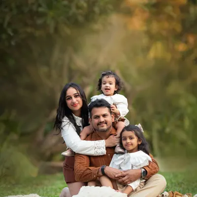 The classic family portrait, but make it relaxed and full of love. We found a perfect spot on the grass for this family of four to snuggle up together during their outdoor session.
