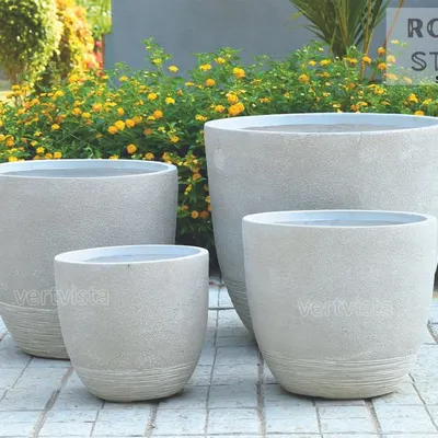 Our ROUGH STONE series features planters with a subtle, stone-like texture, perfect for outdoor landscapes and patios. These lightweight yet sturdy FRP planters are available in various sizes to suit everything from small shrubs to large statement plants.