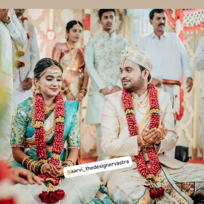 A beautiful moment from the wedding ceremony. Our bride and groom look perfect together in their custom coordinated outfits.