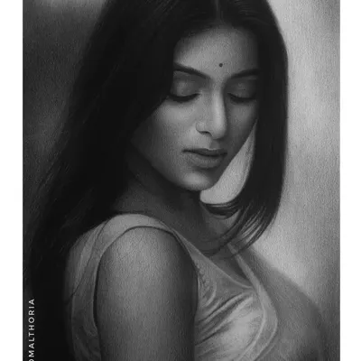 A serene portrait of Rosi Das, where I focused on creating a beautiful play of soft tones and light. This piece is an example of how I use subtle shading to convey emotion.