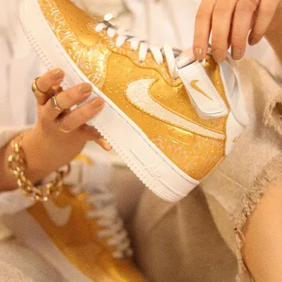 I call this design "Pies Adornados," which is Spanish for "Ornamented Feet." Inspired by an Abu Jani Sandeep Khosla outfit, I painted these golden Nike AF1 mids with intricate Indian patterns for a truly luxurious feel.