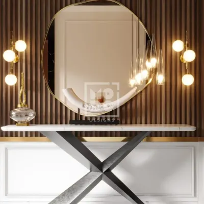 A close-up of the lobby console table, where a modern, abstract mirror and sculptural lighting create an artistic focal point. This composition of clean lines and elegant materials immediately establishes a tone of refined luxury.