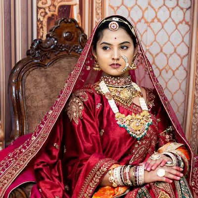For brides who dream of a regal, majestic look, we offer styled portrait sessions. This image, inspired by royal aesthetics, showcases our ability to capture intricate details in bridal wear, jewelry, and expression, creating a timeless piece of art.