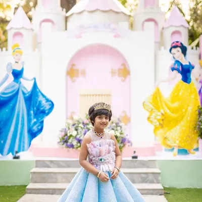 The birthday girl, Princess Aadhya, looking absolutely regal in front of the castle I designed for her. My setups provide the perfect photo opportunity to capture these precious memories.