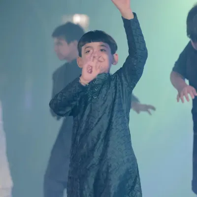 A little star waving to the crowd during his sangeet performance. I love seeing the confidence and joy on the kids' faces when they dance.