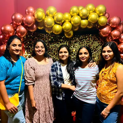 A happy group of friends posing for a photo during their hangout session. This is what it's all about: making good memories together.