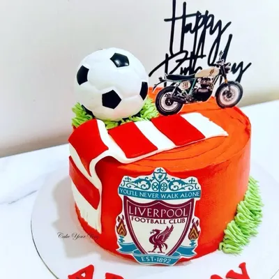 Celebrating in true Liverpool style with this football-themed cake, complete with the team scarf and a motorcycle for the birthday boy's other passion.