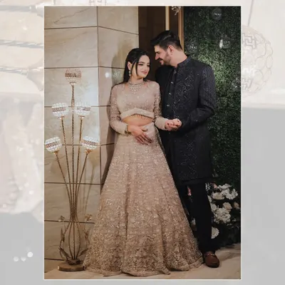 A classic portrait of Rishul and Vanshika at their sagan ceremony, sharing a sweet glance.