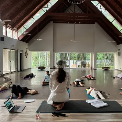 A beautiful, spacious hall filled with our Sangat in Savasana, the final resting pose. This is a moment of deep integration and surrender after our practice.