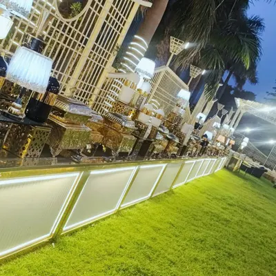 Our premium LED-lit buffet counter adds a modern and luxurious feel to this outdoor evening event.