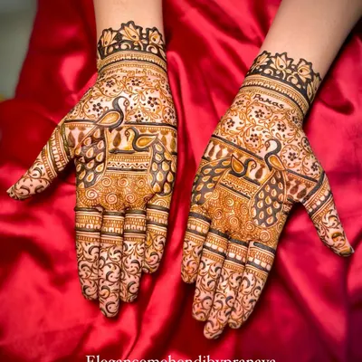 An elegant design focusing on my signature peacocks, with intricate feathers and details that fill the hands.