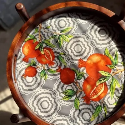 This serving trolley features a hand-painted pomegranate design. It’s a piece of functional art that’s perfect for entertaining, bringing a touch of nature-inspired beauty into your home.