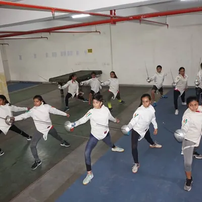 A perfect demonstration of the lunge, one of the most important offensive actions in fencing. Our students practice these fundamental movements together to build strength and coordination.