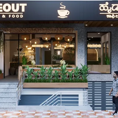 The exterior of Hideout Cafe was designed to be a beacon for coffee lovers. The clear branding, combined with a welcoming staircase and a preview of the green, airy interior, makes a compelling invitation to step inside.