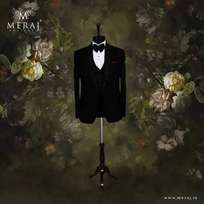 This black velvet tuxedo is the epitome of classic sophistication. I crafted it with self-embossed designs and delicate hand embellishments on the lapel for a subtle yet luxurious finish.