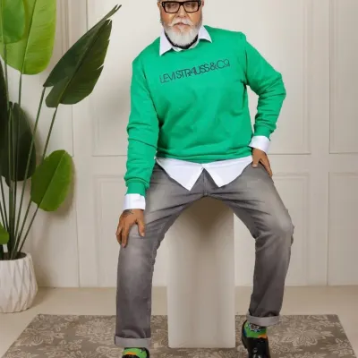 Makeup for the celebrity actor Dinesh Mohan. This look complements his trendy outfit, focusing on clean skin and defined features for a sophisticated and statement-making appearance.
