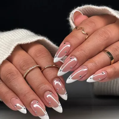 The full two-hand view of this glamorous French manicure. The almond shape, clean white tips, and scattered silver gems create a look that is both classic and modern.