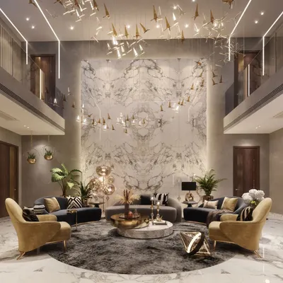 Redefining luxury with this double-height living room in Agra. The symmetrical design, book-matched marble wall, and a flock of suspended bird-like lights create a dramatic and opulent focal point, showcasing our expertise in creating grand, architectural interiors.