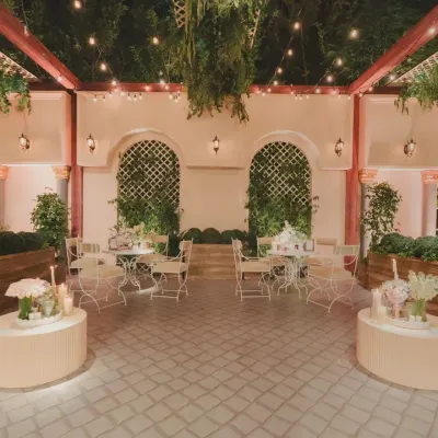 For a cocktail soirée, we transformed the venue into a Parisian courtyard. With soft lighting, classic architecture, and cozy seating, the space felt intimate, romantic, and effortlessly chic.