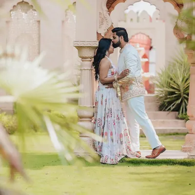 A fine-art portrait from a pre-wedding shoot at a location with stunning architecture. The composition and soft light create a truly romantic and regal photograph.