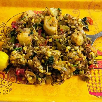 A perfect example of a healthy, high-protein, and low-calorie meal. This dish with sprouts, potatoes, and vegetables is delicious and takes you closer to your fitness goals.