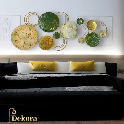 A closer look at our popular green and gold abstract wall sculpture. The varying sizes and textures of the discs, combined with open wire rings, create a dynamic and visually engaging piece.
