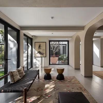 The entrance colonnade of the Mango Orchard House, with its series of arches, frames views of the garden and the internal courtyard, creating a beautiful transition from the outdoors in.