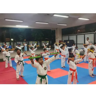 Students practicing with Nunchaku, a traditional martial arts weapon. Weapon training improves coordination, focus, and provides an advanced skill set.
