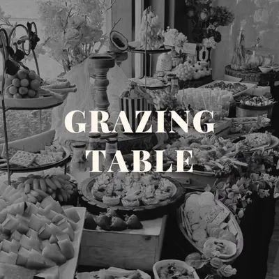 A grazing table is more than just food; it's an interactive centerpiece for your event. This black and white shot highlights the sheer abundance and intricate arrangement of our spreads.