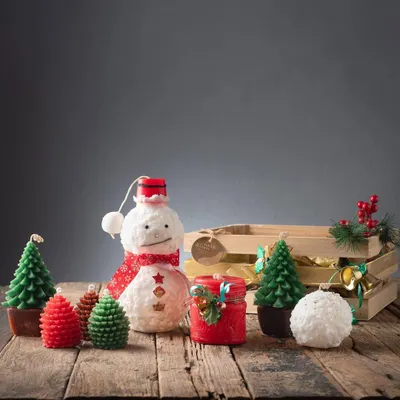 A glimpse of my Christmas collection, featuring a variety of handmade candles like the snowman, Christmas trees, pinecones, and festive jar candles. Each piece is designed to bring holiday cheer.