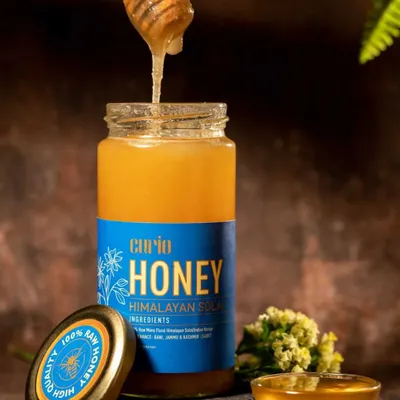 Action shots bring a product to life. Capturing this thick, golden honey as it drips from the dipper creates a dynamic and mouth-watering image that communicates the product's quality and natural texture.
