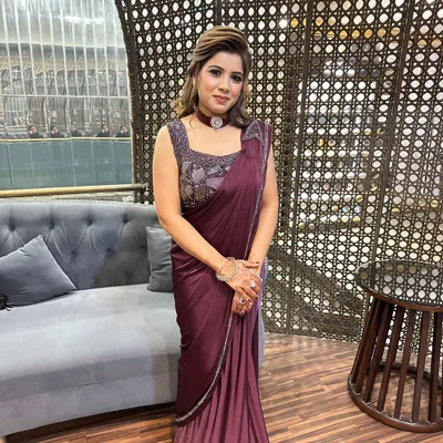 A beautiful client ready for a party in an elegant saree. I gave her a sophisticated look with a soft updo and makeup that highlights her eyes.
