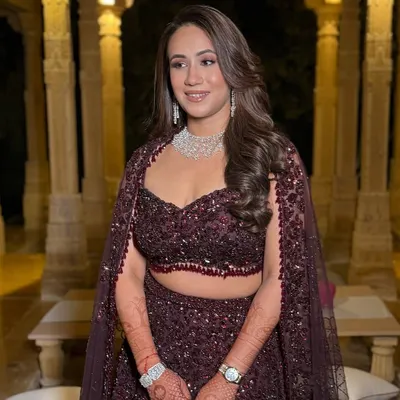 This bride's impeccable skin deserved a glow to match for her reception. I created a sophisticated look with a soft smokey eye and a nude lip to complement her stunning jewel-toned Seema Gujral design.