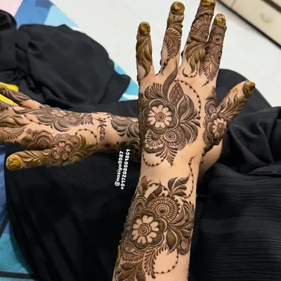 A candid shot of a completed floral design. This is the moment of satisfaction before the paste comes off to reveal the beautiful stain underneath.