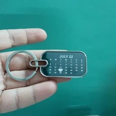 Keep a special date close with this personalized calendar keychain. I can engrave any month and highlight a specific day with a heart.
