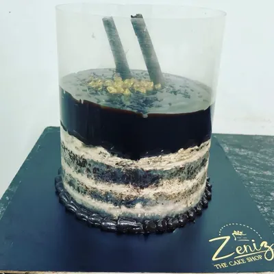 Get ready for a delicious surprise with my pull-me-up cake. When you lift the plastic collar, a wave of rich chocolate ganache flows down the sides of the cake.