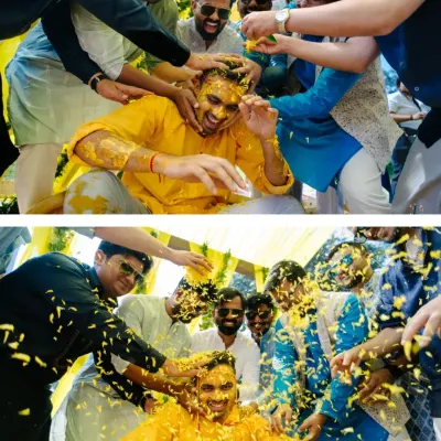 The groom is playfully covered in turmeric and flower petals by his friends. This is the kind of joyful chaos I love to capture during a Haldi ceremony.