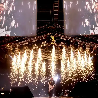 Capturing the peak moment of a concert, with stage pyrotechnics erupting as music legend Yuvan Shankar Raja performs.